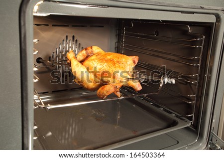 Appetizing roast chicken in the oven.