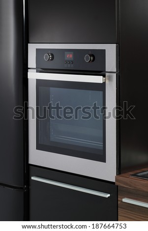 Electric oven built into kitchen furniture