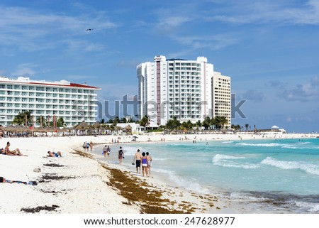 CANCUN - JANUARY 22: Tourists enjoy the sunny weather and relaxing on the beautiful beach on 22 January 2015 in Cancun, Mexico. This is one of the best beaches in the Mexico.