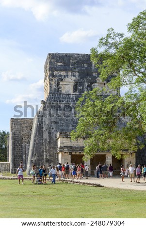 CHICHEN ITZA - JANUARY 19: Tourists visiting Chichen Itza, one of the most visited sites in Mexico on 19 January 2015 in Chichen Itza, Mexico. It is one of new 7 wonders in the world.