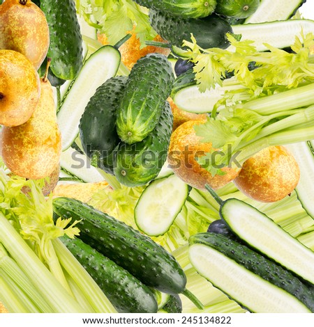 Abstract background with slices of fresh cucumber, pear and celery. Seamless pattern for a design. Close-up. Studio photography