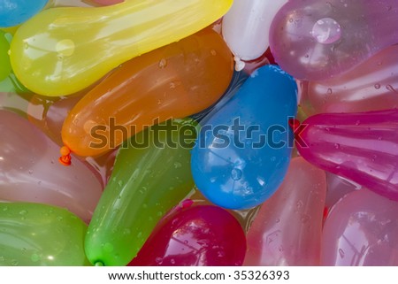 A bunch of water balloons in water