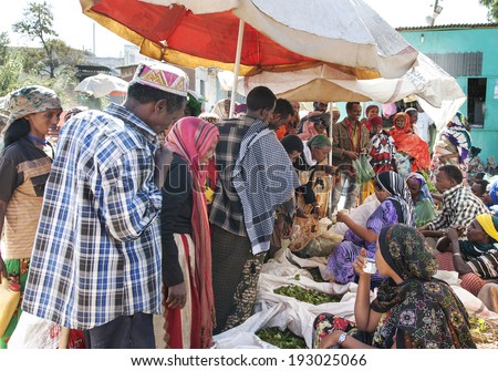 HARAR - ETHIOPIA - DECEMBER 26, 2012: A group of people selling Khat drugs at the Marketplace in Harar. Khat chewing has a history as a social custom dating back thousands of years in Harar, Ethiopia.