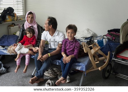 Munich-Germany- September 22, 2015\
Refugee family from Afghanistan in the initial reception center for refugees in Riem, Munich