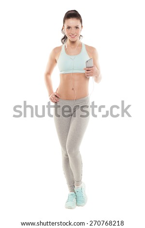 fitness girl with a smartphone on a white background, enjoys sports training, gym workout