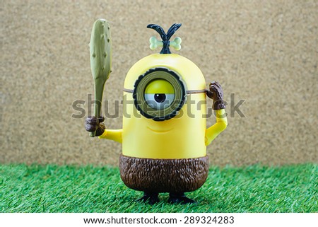 Bangkok,Thailand - June 21, 2015: Cro-Minion on green grass  fictional character from Minions animated 3D film produced by Illumination Entertainment for Universal Pictures.