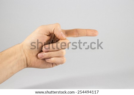 Closeup of male hand showing thumbs up sign against white background, Hand with two fingers up in the peace or victory symbol. Also the sign for the letter V in sign language. Isolated on white