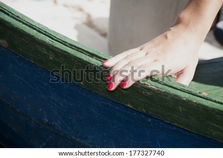 Hand on boat.