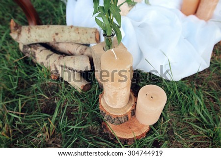 not lighted candles on logs. Wedding decoration