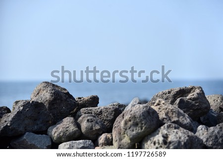 Close up of basalt wall in Jeju island, horizontal line, sea line