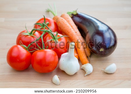 Fresh vegetables organic food set still life with eggplant, carrot, garlic and tomato