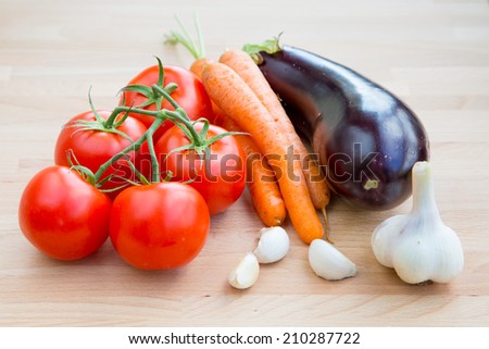 Fresh vegetables organic food set still life with eggplant, carrot, garlic and tomato