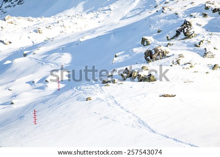 The mountain view, Traces and signposts in the snow at tourist routes at  the station of the Aiguille du Midi in Chamonix, France