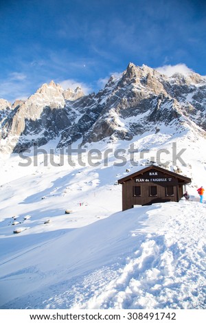 Chamonix, France - January , 28, 2015: Bar near the middle station of Cable Car Telepherique Aiguille du Midi at winter time. Snow rocks behind