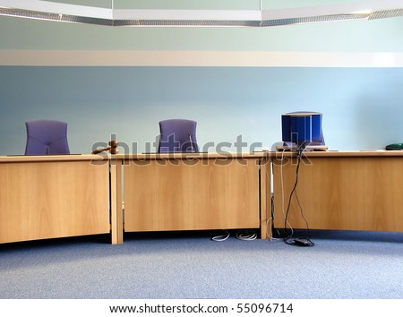 Court\'s room with tables,chairs,computer and hammer