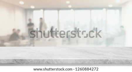 Empty white marble stone tabletop and blurred bokeh office interior space banner background - can used for display or montage your products.