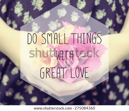 Inspirational quote on blurred hand&flower background with vintage filter