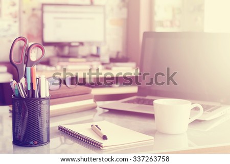 Stationery,focused on pen in Blurred background workspace with vintage filter