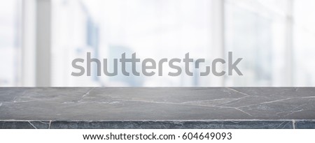 Stone table top and blur glass window wall building banner background with vintage filter - can used for display or montage your products.