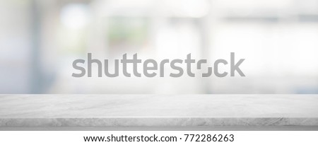 White stone marble table top and blurred abstract background from interior building banner background - can used for display or montage your products.