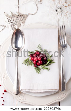 Christmas And New Year Holiday Table Setting with cranberry and rosemary decoration,-Holiday decoration.