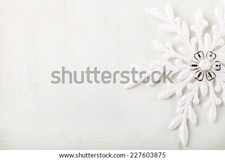 Christmas and New Year background Snowflake on a white wooden background Copy space Christmas and New Year background Snowflake on a white wooden background Copy space