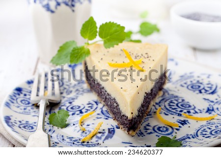 Poppy seed cream tart, cake, pie slice with lemon zest and fresh mint on a white background