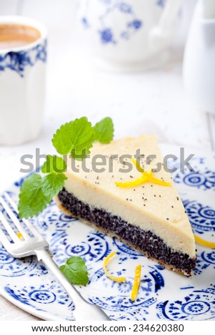 Poppy seed cream tart, cake, pie slice with lemon zest and fresh mint on a white background