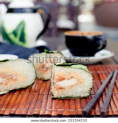 Banh chung, Traditional present for Lunar New Year, Vietnamese traditional dish. Sticky rice cake with meat , covered with banana leaves and, tied with bamboo rope