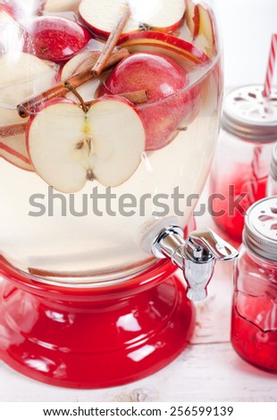 Apple and cinnamon lemonade, drink in a glass beverage, water dispenser