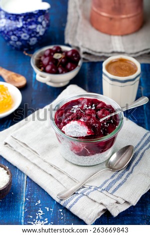 Chia seed pudding, dessert with cherries  and granola. Healthy breakfast