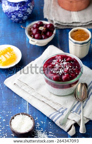 Chia seed pudding, dessert with cherries  and granola. Healthy breakfast