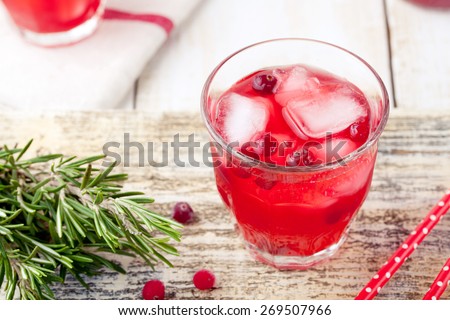 Cranberry and rosemary lemonade, cocktail, fizz on a white wooden background