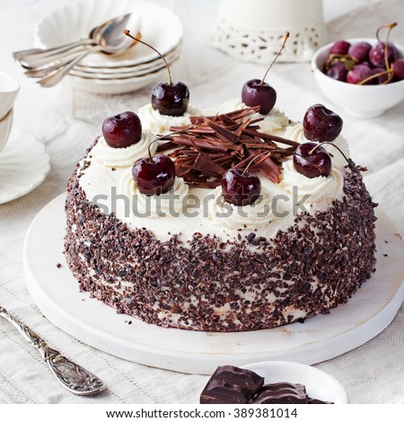 Black forest cake, Schwarzwald pie, dark chocolate and cherry dessert on a white wooden background