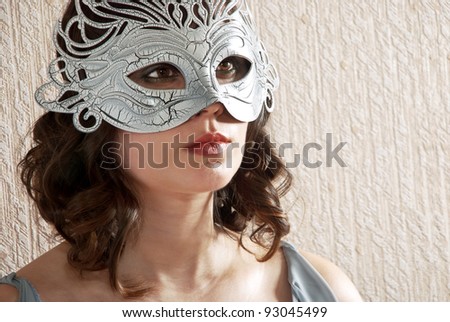 Beautiful woman in black and white masquerade mask.
