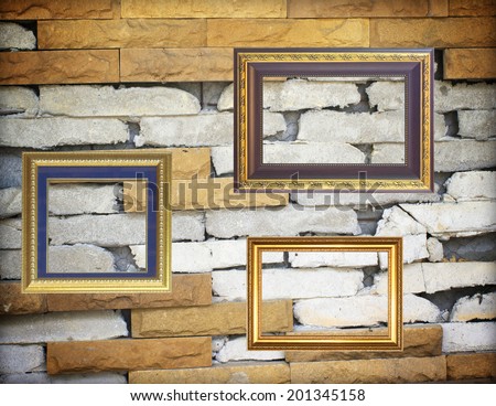 Old antique gold picture frame wall stone walls.