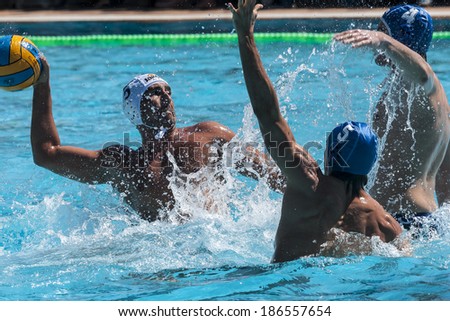 MATARO, SPAIN - APRIL 5: Players in action during the water polo Spanish League match between Mataro and Sant Andreu, final score 7-7, on April 5, 2014, in Mataro, Barcelona, Spain.