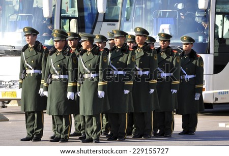 Chinese soldiers in Beijing - Tiananmen Square. Editorial. 19.11.2013