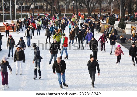 MOSCOW - NOV 22: People ice skating outdoors in the Gorky park on a lovely sunny day in Moscow on november 22.2014 RUSSIA