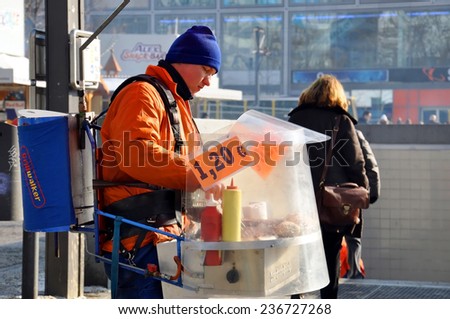 BERLIN - FEB 08: Guy selling hot dogs on the Alexanderplatz on February 08.2012 in Berlin. Germany.