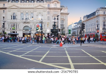 LONDON - MAY 15: People and traffic in Piccadilly Circus in the evening on May 15.2014 in UK. A famous space in London\'s West End, it was built in 1819 to join Regent Street with street off Piccadilly