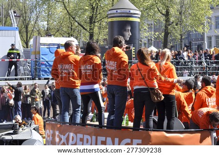 AMSTERDAM APR 27: The crowd of teenagers at the party during celebration Queensday in Amsterdam on April 27. 2015 in Holland