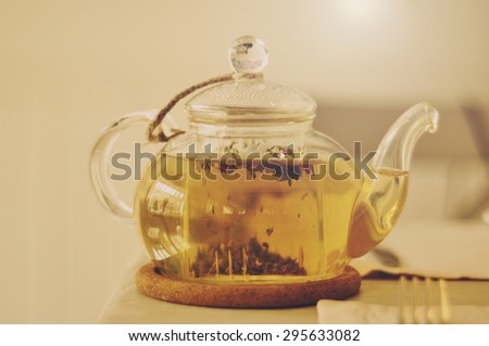 Teapot with herbal tea - light vintage effect