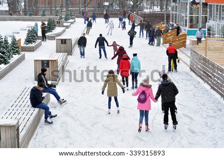 MOSCOW - NOV 15: People ice skating outdoors in the Gorky park during a snowfall in Moscow on November 15.2015 in Russia