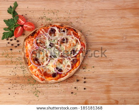 Thin crust pepperoni pizza on wooden board