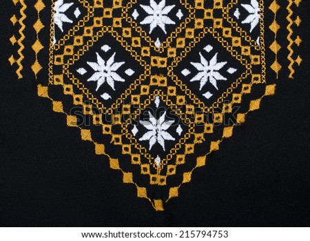 Ukrainian women\'s dress shirt, yellow embroidery on a black background