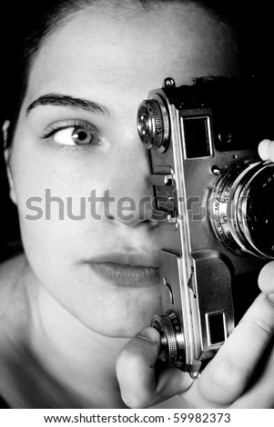 Girl behind camera is blur because evri photografer is invisible when shot his photography