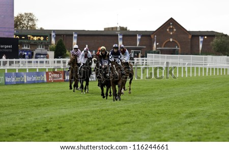 CHELTENHAM, GLOUCS, OCT 20 2012, Jockey Richard Johnson leads the horses to the start of the first race at Cheltenham Racecourse, Cheltenham UK Oct 20 2012