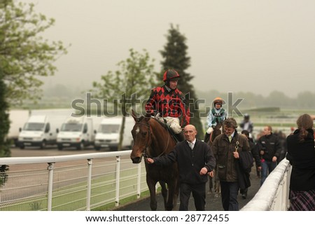 CHELTENHAM, GLOUCS, APRIL 17 2009: Jockey Paul Moloney rides Prince of Gdansk back from competing in the second race at the April National Hunt Meeting at Cheltenham Racecourse, UK