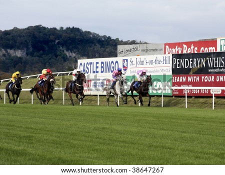 CHEPSTOW, MONMOUTHSHIRE – OCTOBER 10: jockeys Paddy Brennan and Sam Thomas jostle for position in the Free Bets Handicap Steeple Chase on October 10, 2009 at Chepstow Racecourse, UK.